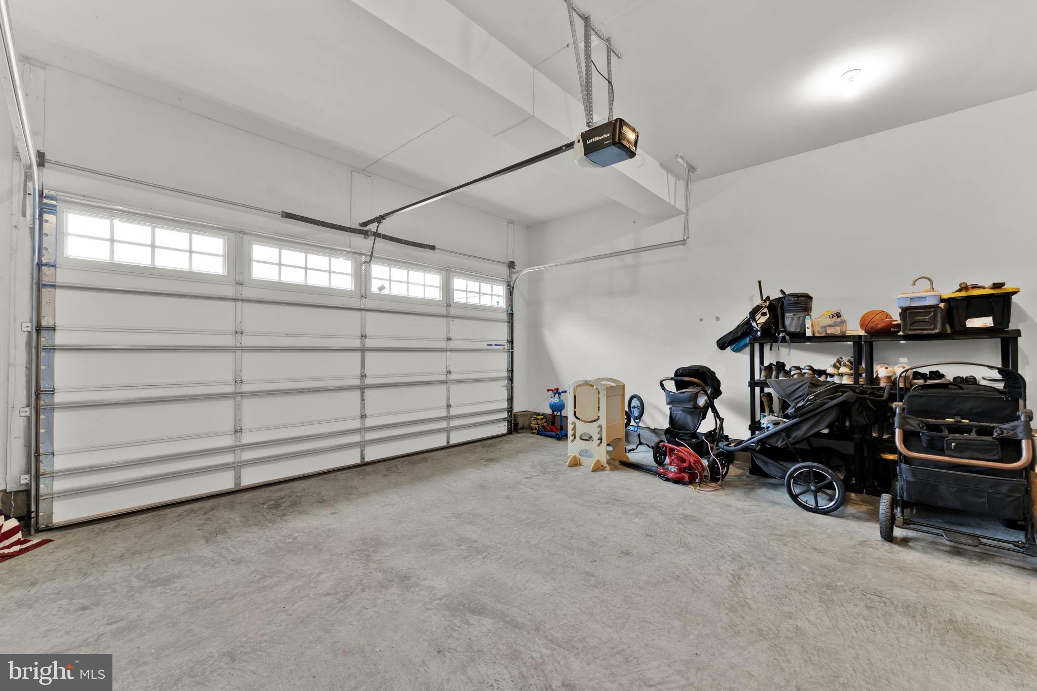 6310 Winters Lane Hanover, MD 21076 - Photo 75 of 76 a view of a garage with parked cars