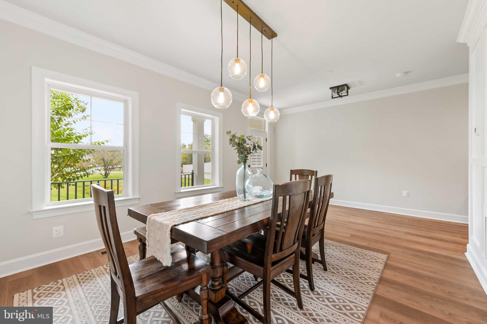 6310 Winters Lane Hanover, MD 21076 - Photo 8 of 76 a view of a dining room with furniture window and wooden floor