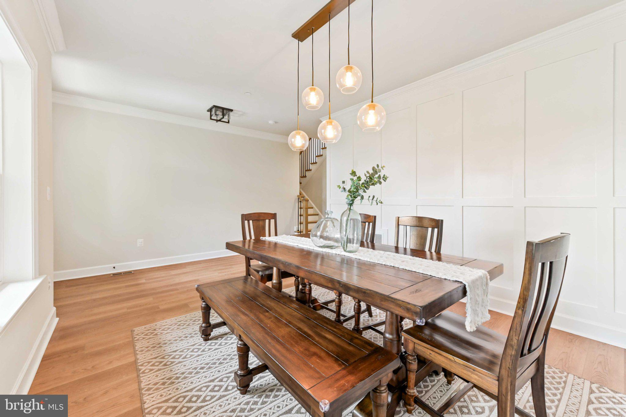 6310 Winters Lane Hanover, MD 21076 - Photo 9 of 76 a dining room with furniture and wooden floor