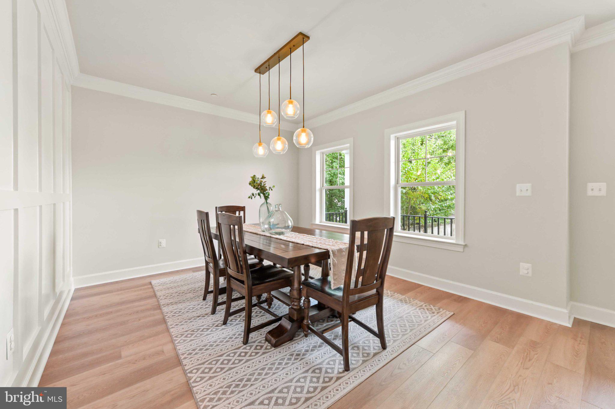 6310 Winters Lane Hanover, MD 21076 - Photo 10 of 76 a view of a dining room with furniture window and wooden floor
