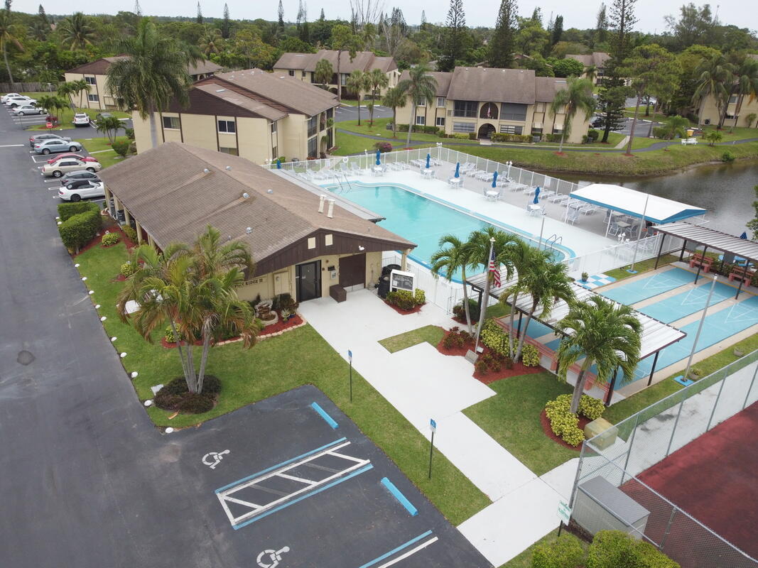 320 Pine Ridge Circle, Unit A1 Greenacres, FL 33463 - Photo 55 of 65 an aerial view of a house with a yard