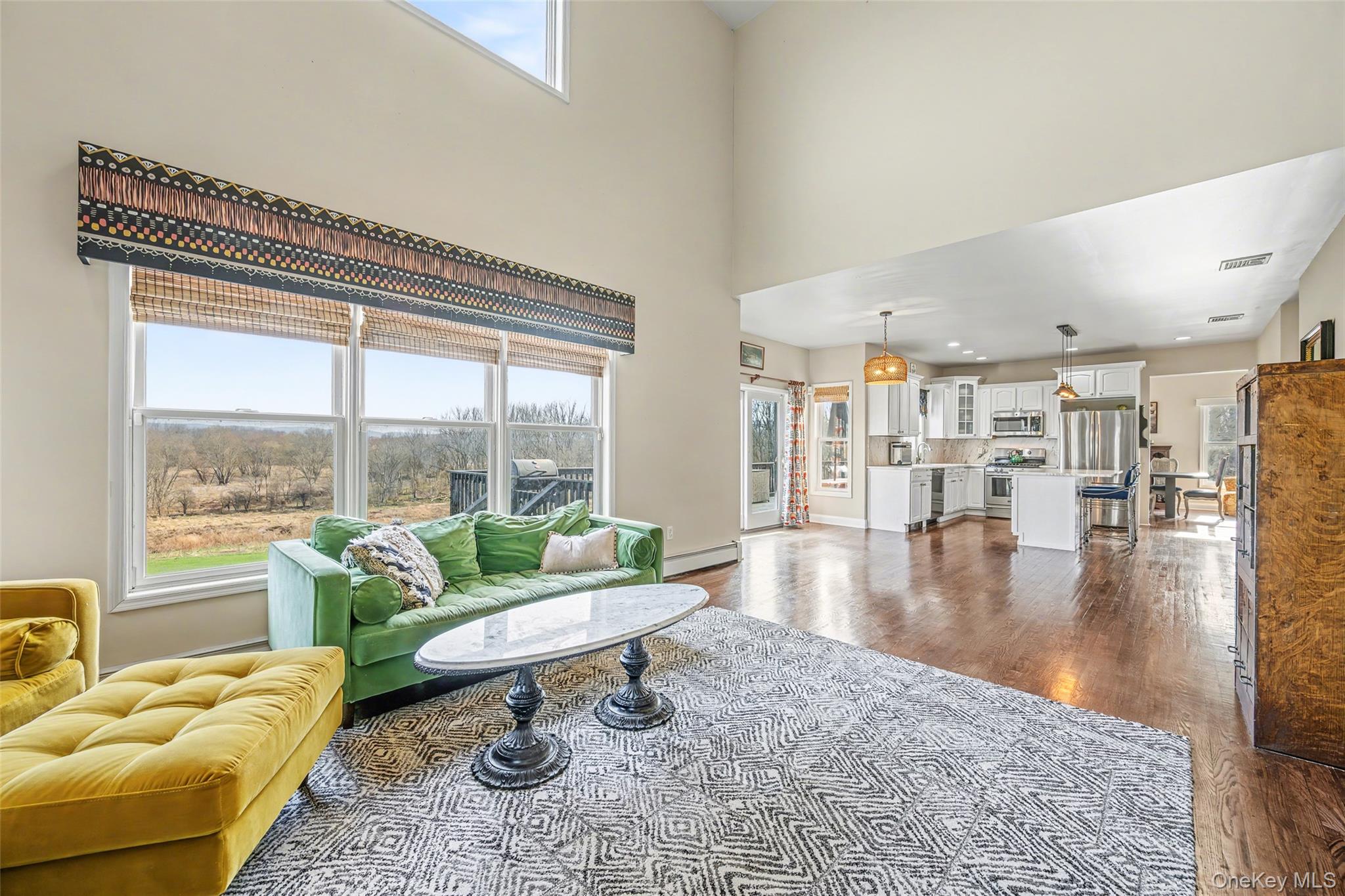 67 Liberty Corners Road Pine Island, NY 10969 - Photo 11 of 42 a living room with furniture and floor to ceiling windows