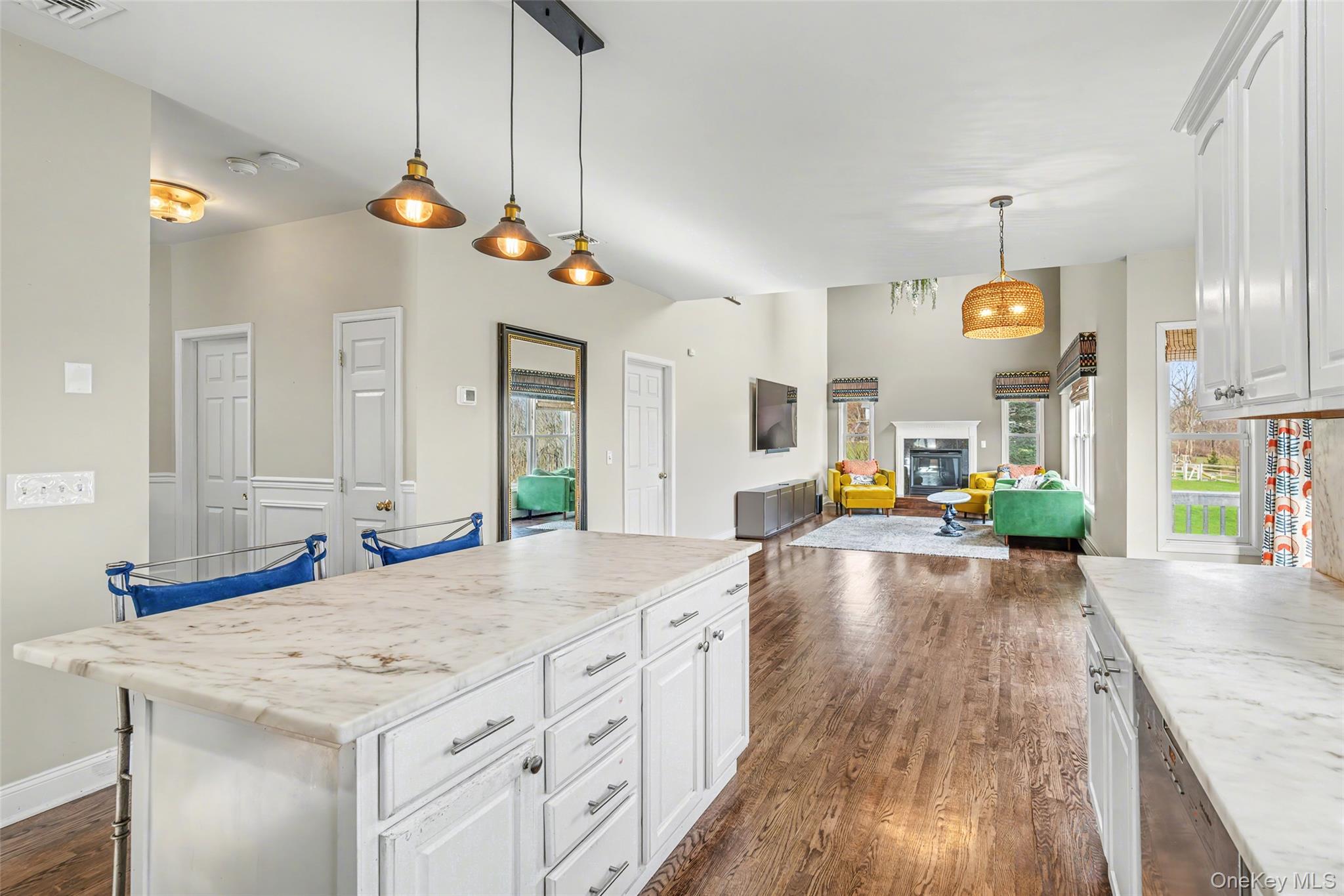 67 Liberty Corners Road Pine Island, NY 10969 - Photo 14 of 42 a view of a kitchen island a chandelier and wooden floor