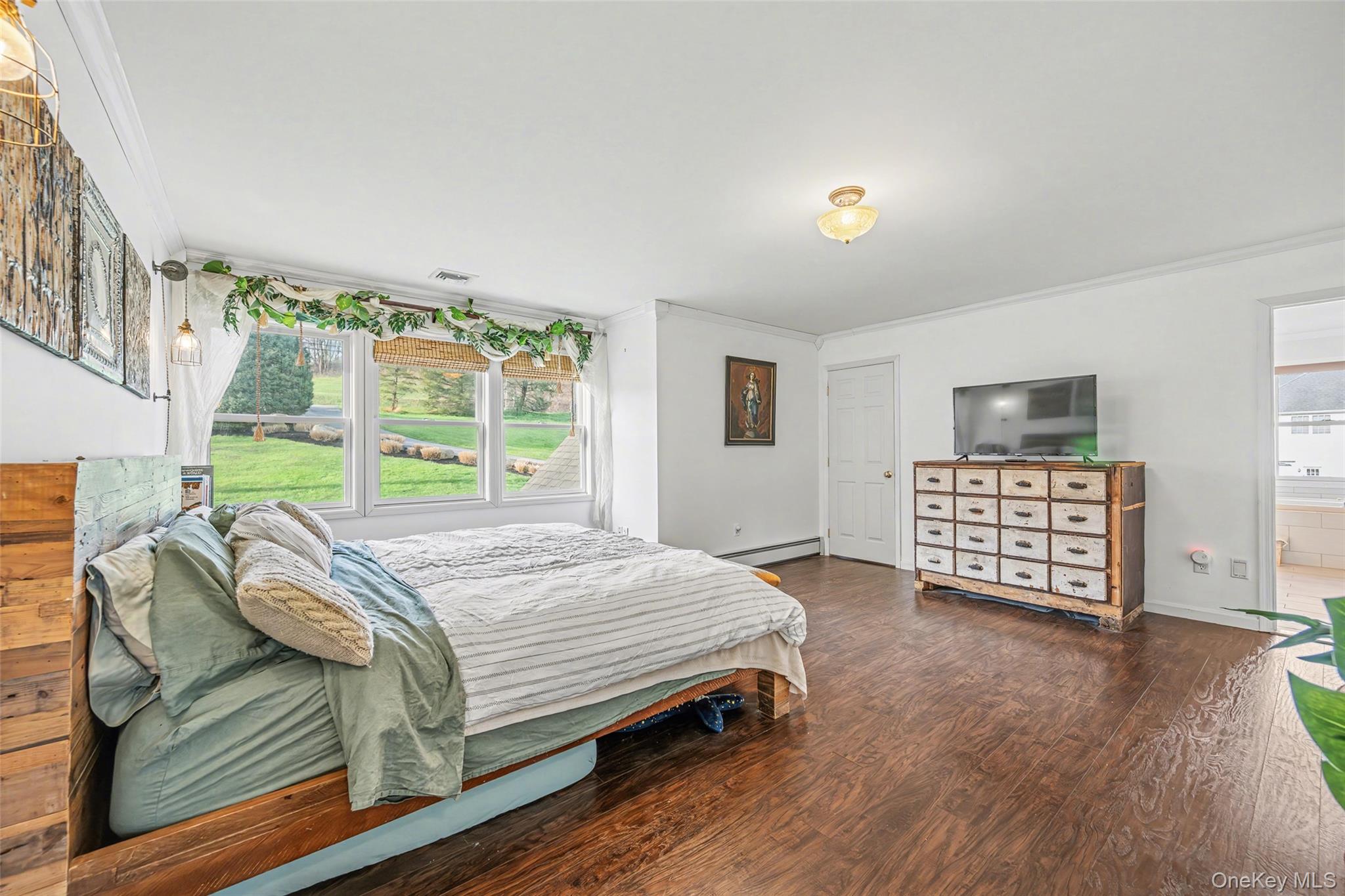 67 Liberty Corners Road Pine Island, NY 10969 - Photo 22 of 42 a bed sitting in a bedroom next to a window