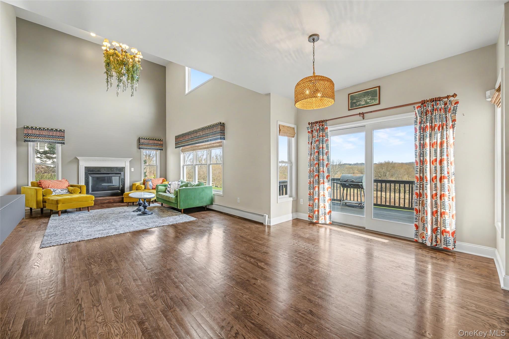 67 Liberty Corners Road Pine Island, NY 10969 - Photo 8 of 42 a view of a livingroom with furniture wooden floor windows and a chandelier