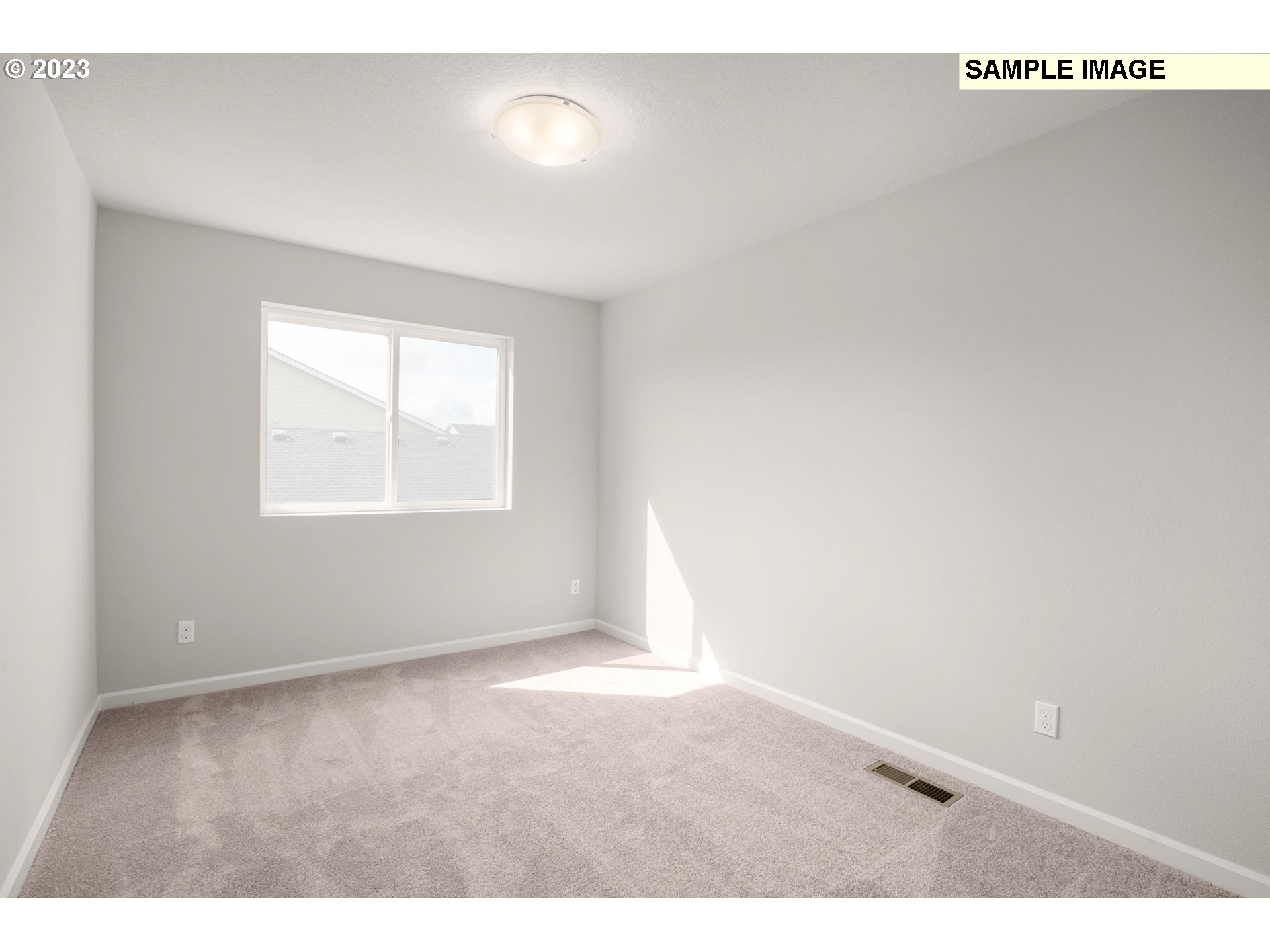 2193 Southeast Osprey Avenue Gresham, OR 97080 - Photo 19 of 24 an empty room with wooden floor and windows