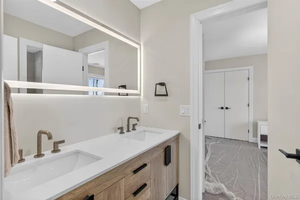 a bathroom with a sink and a mirror