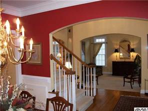 3336 Rhett Butler Place Charlotte, NC 28270 - Photo 4 of 16 a view of a livingroom with furniture and stairs