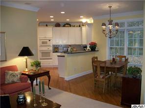 3336 Rhett Butler Place Charlotte, NC 28270 - Photo 8 of 16 a view of a dining room with furniture and chandelier