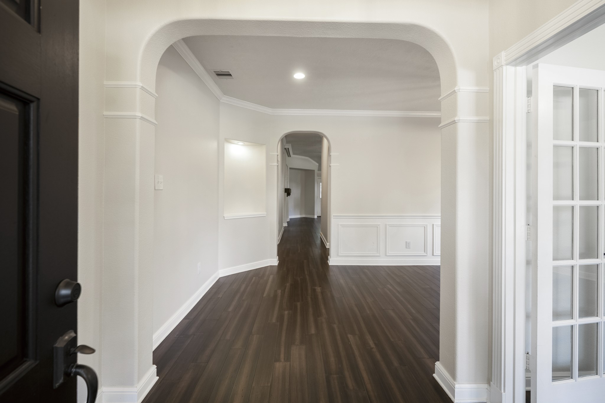 5802 Sawyer Bend Lane Spring, TX 77379 - Photo 4 of 50 a view of a hallway with wooden floor and staircase