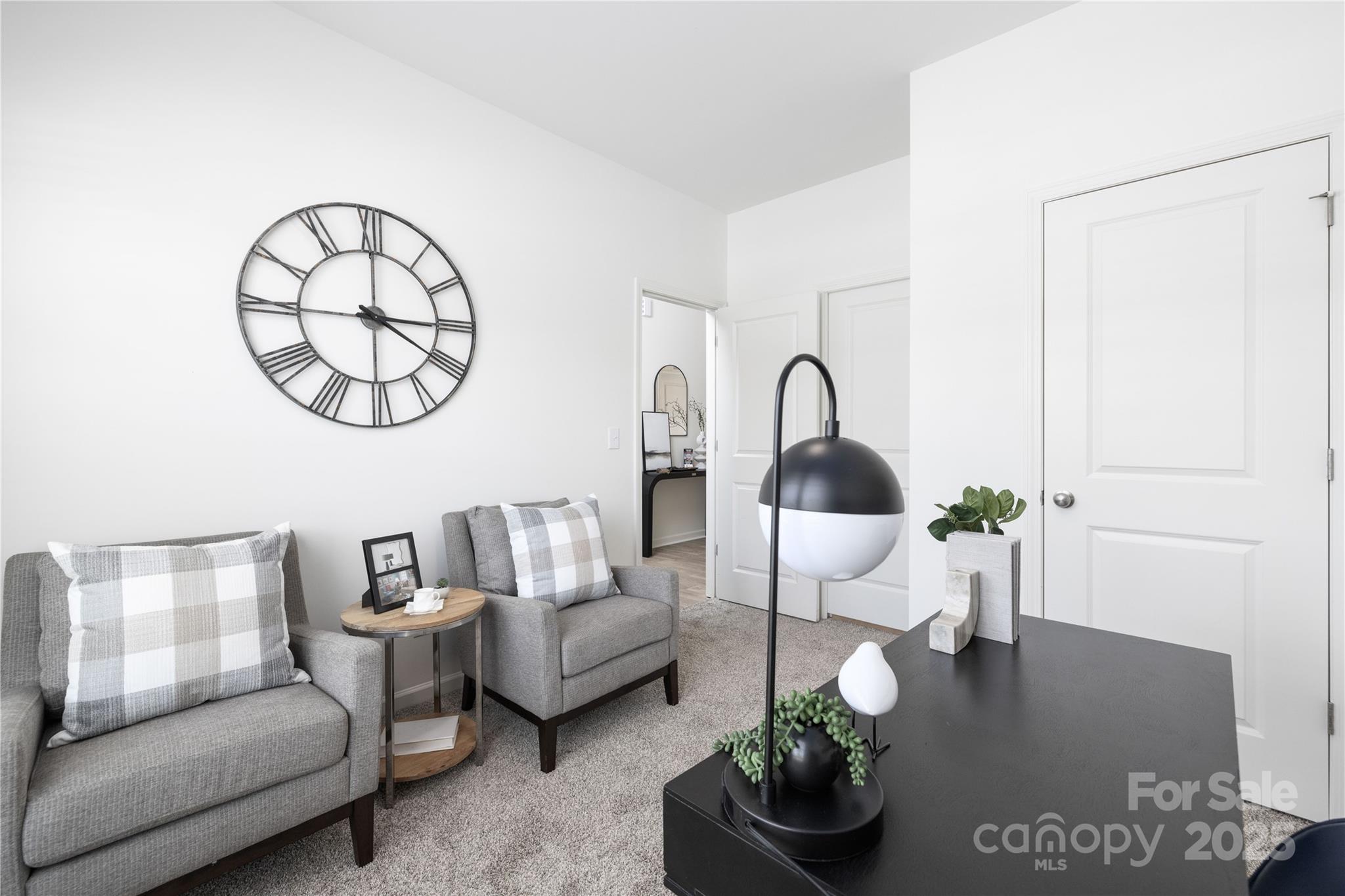12536 Gotland Road, Unit 330 Midland, NC 28107 - Photo 15 of 28 a living room with furniture a table and wooden floor
