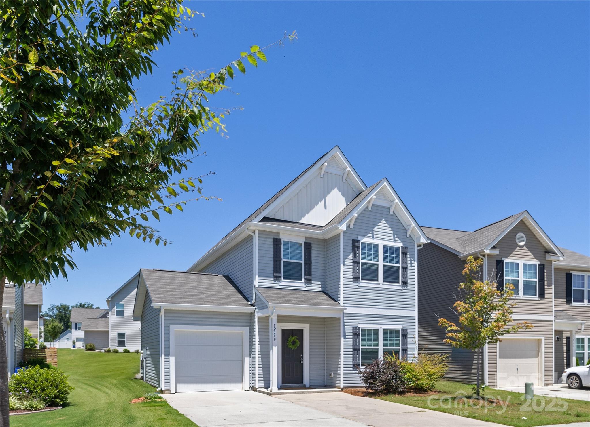 12536 Gotland Road, Unit 330 Midland, NC 28107 - Photo 2 of 28 a front view of a house with a garden