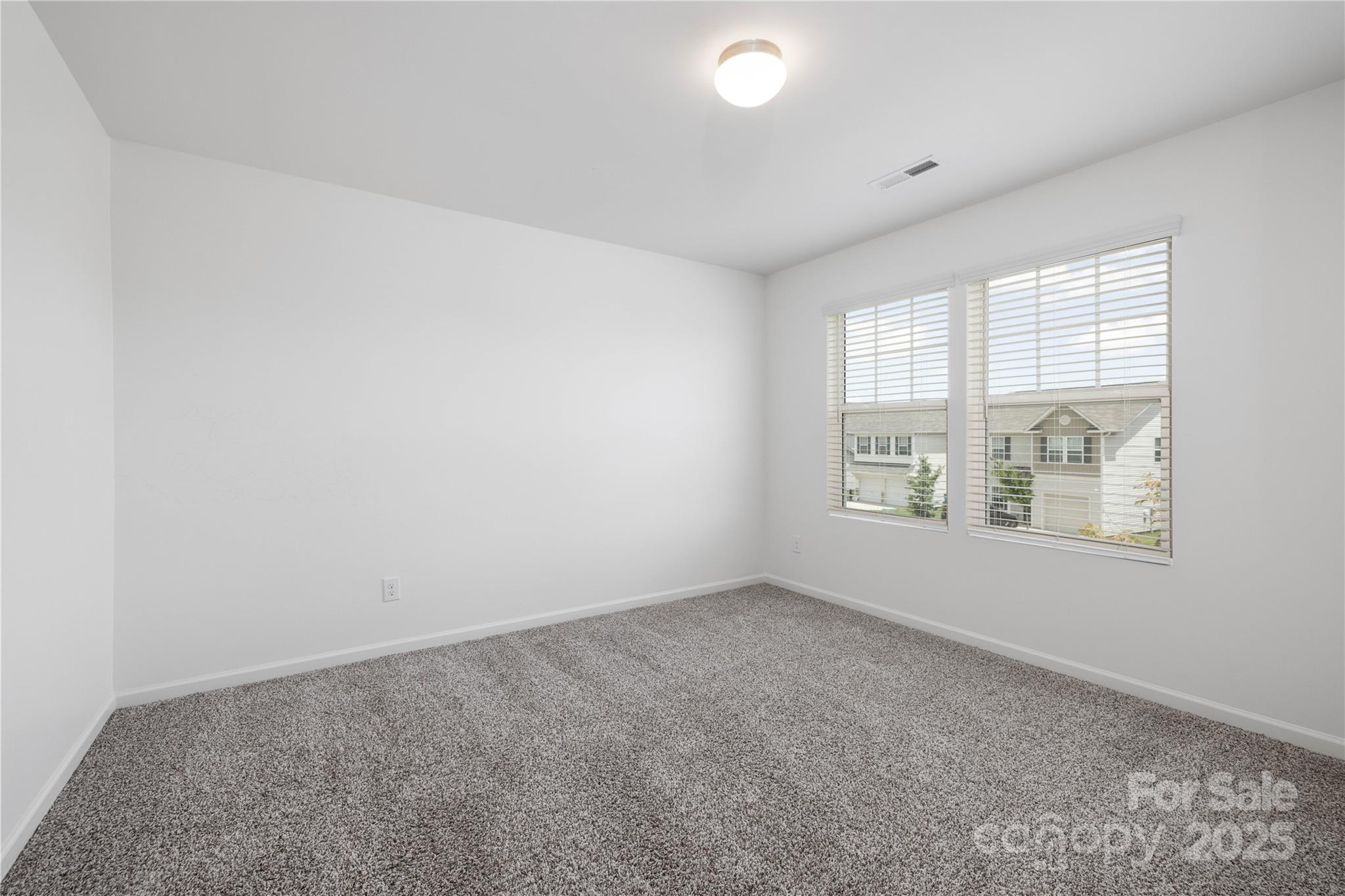 12536 Gotland Road, Unit 330 Midland, NC 28107 - Photo 24 of 28 an empty room with windows