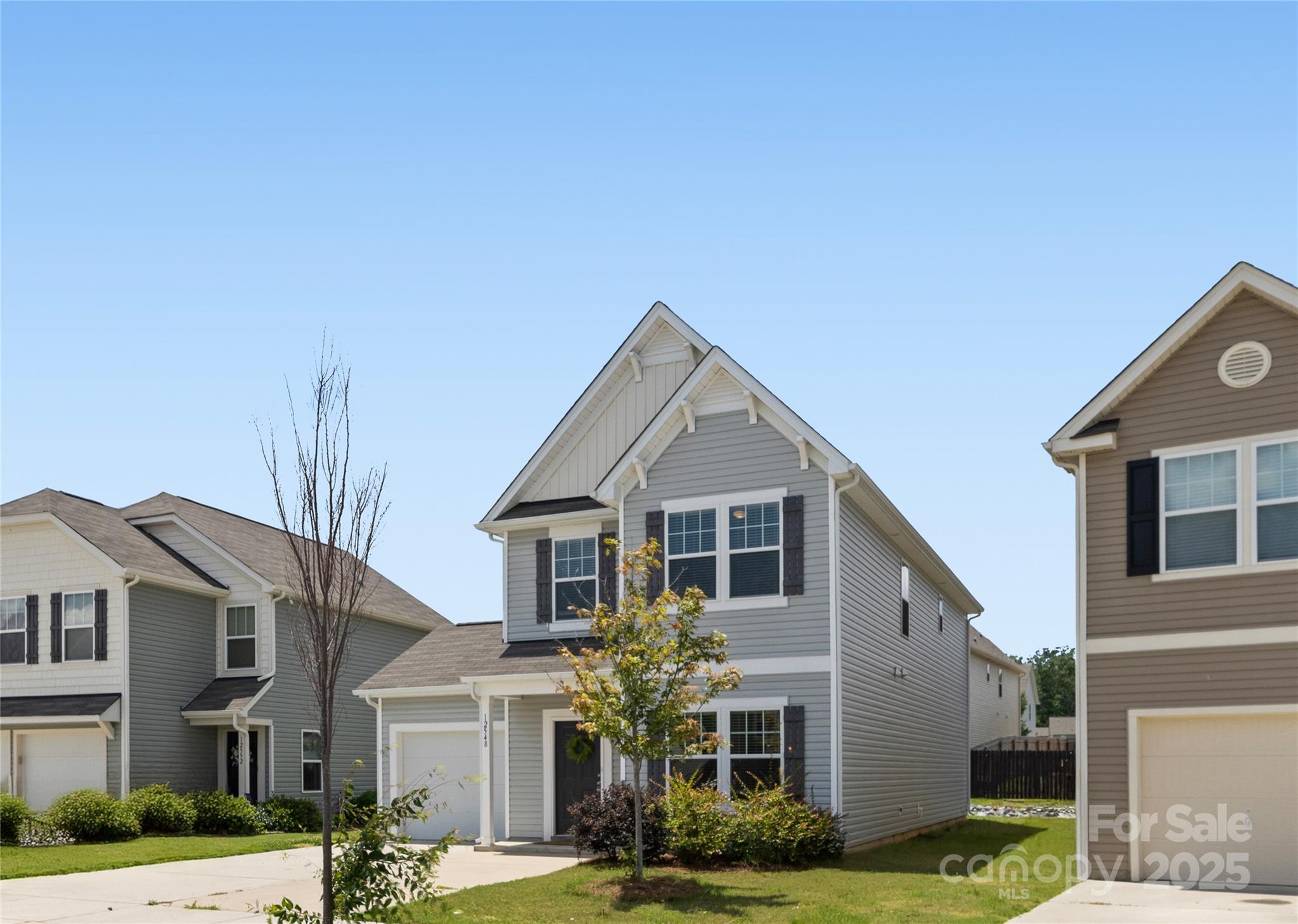 12536 Gotland Road, Unit 330 Midland, NC 28107 - Photo 3 of 28 a view of a white house with large windows