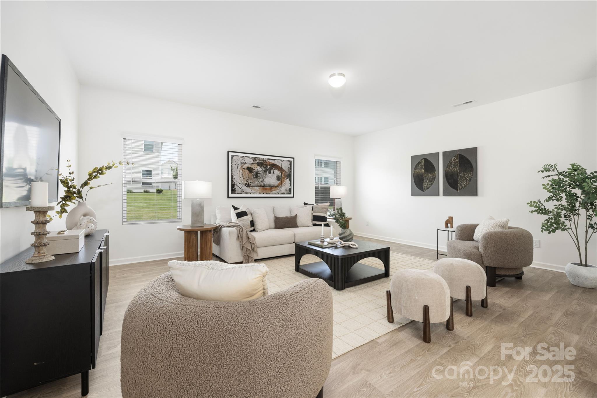 12536 Gotland Road, Unit 330 Midland, NC 28107 - Photo 5 of 28 a living room with furniture and a flat screen tv