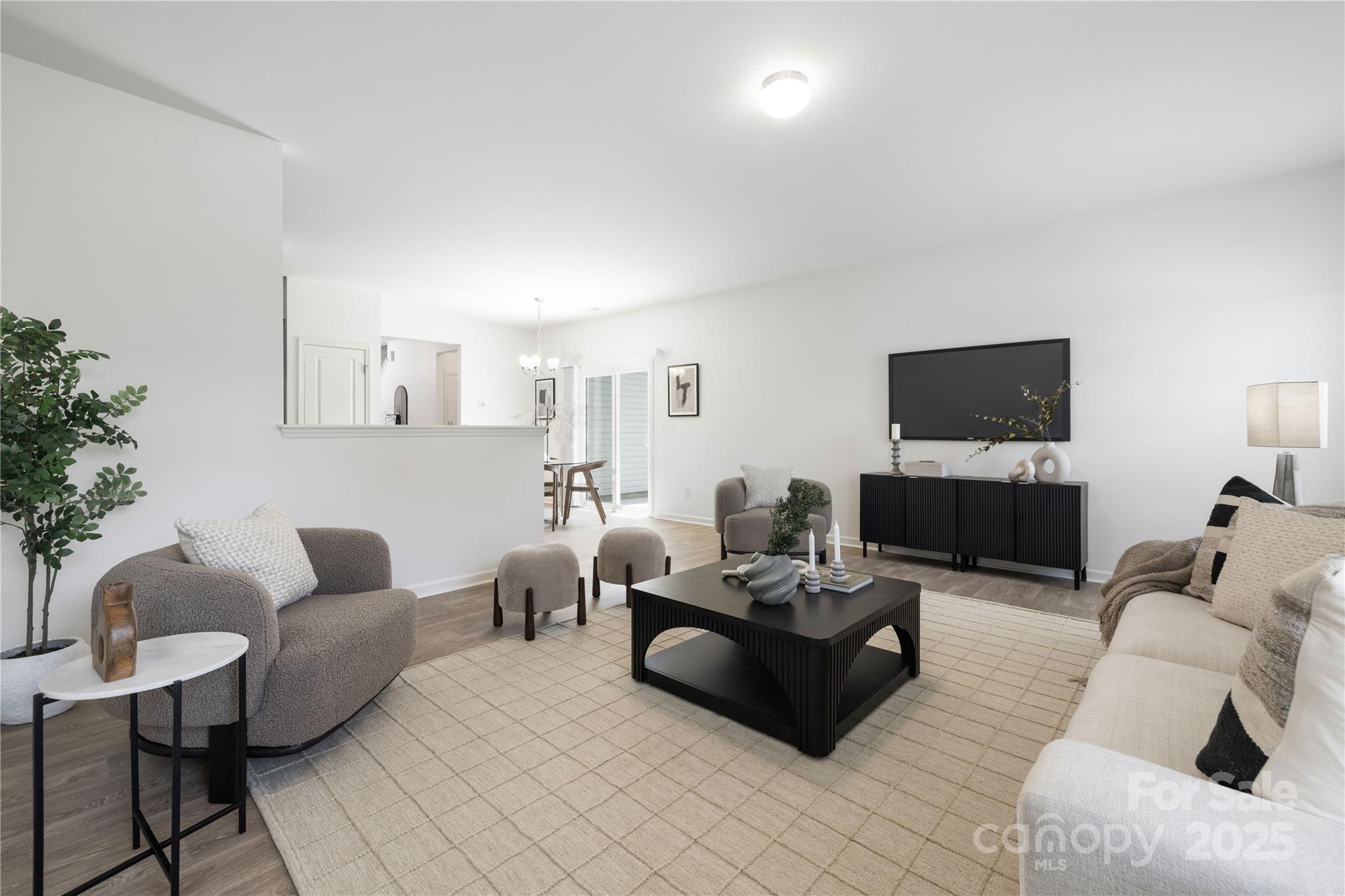 12536 Gotland Road, Unit 330 Midland, NC 28107 - Photo 6 of 28 a living room with furniture a flat screen tv and a couch