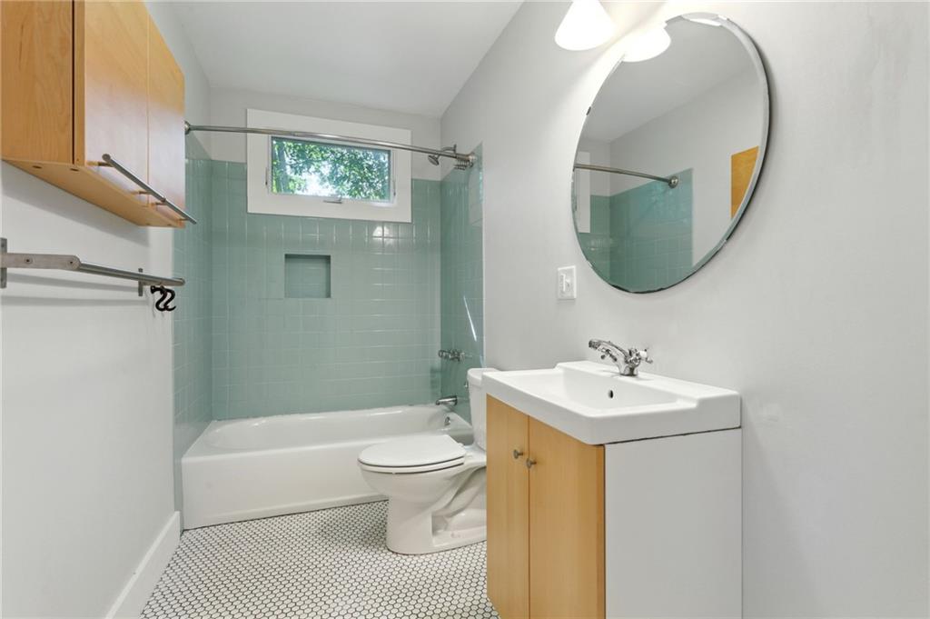 385 Sunset Drive Athens, GA 30606 - Photo 28 of 48 a bathroom with a sink toilet and a mirror