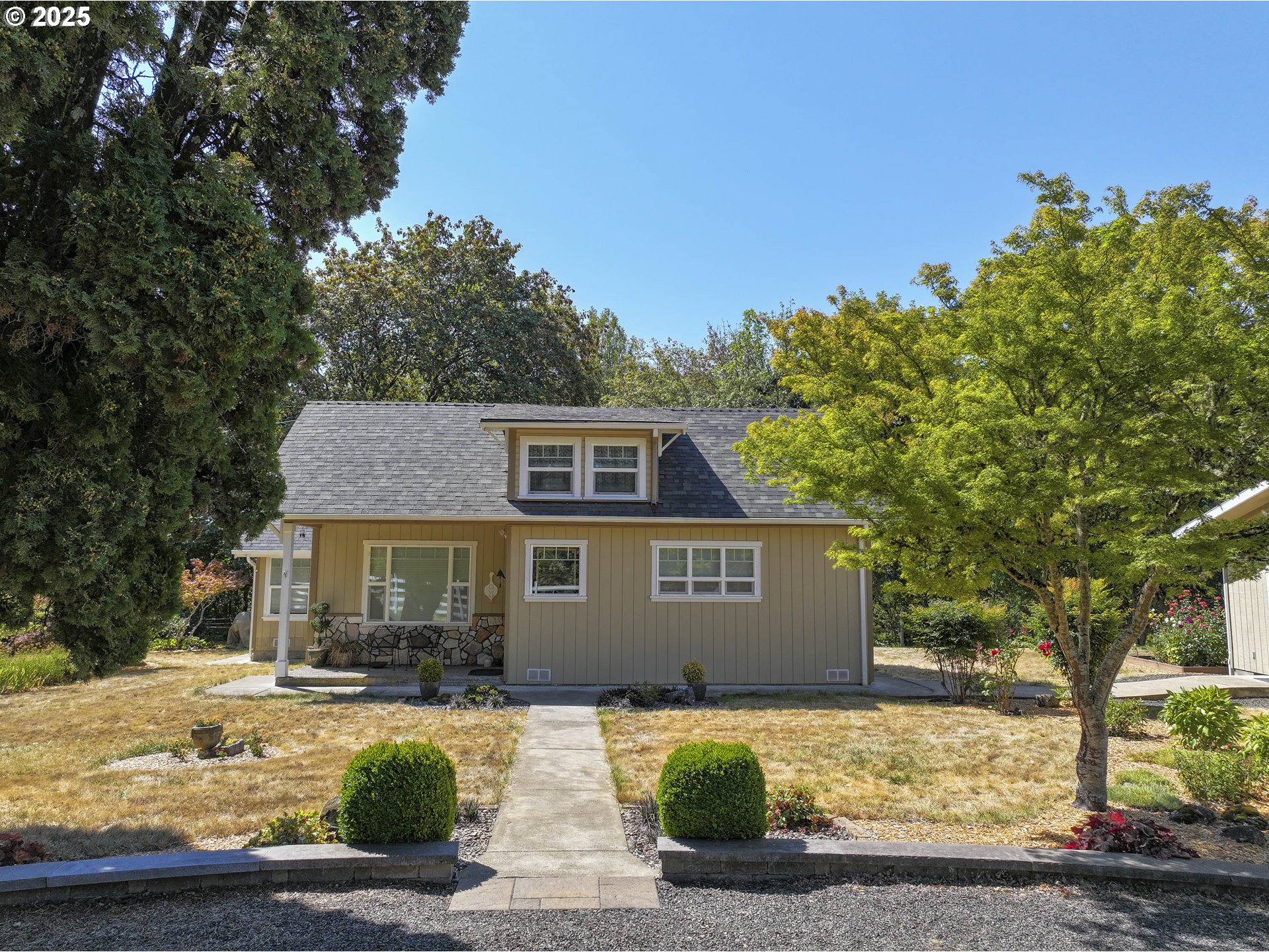 8205 Southwest Broadmead Road Amity, OR 97101 - Photo 2 of 30 a front view of a house with a yard and garage