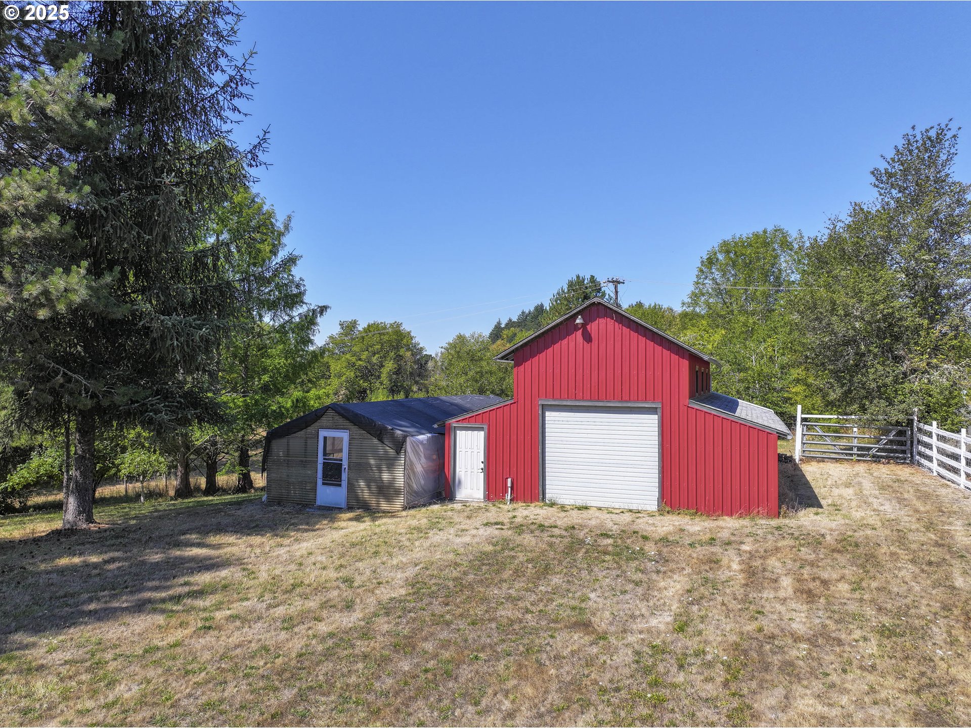 8205 Southwest Broadmead Road Amity, OR 97101 - Photo 30 of 30 a front view of a house with a yard and garage