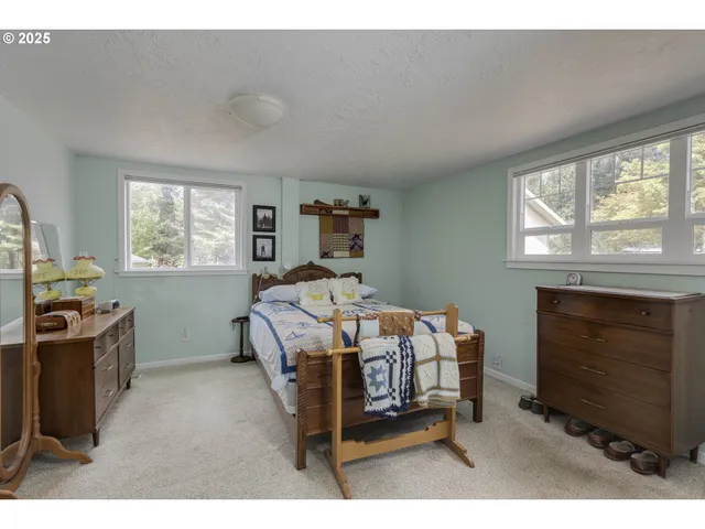 a bedroom with furniture and a fireplace
