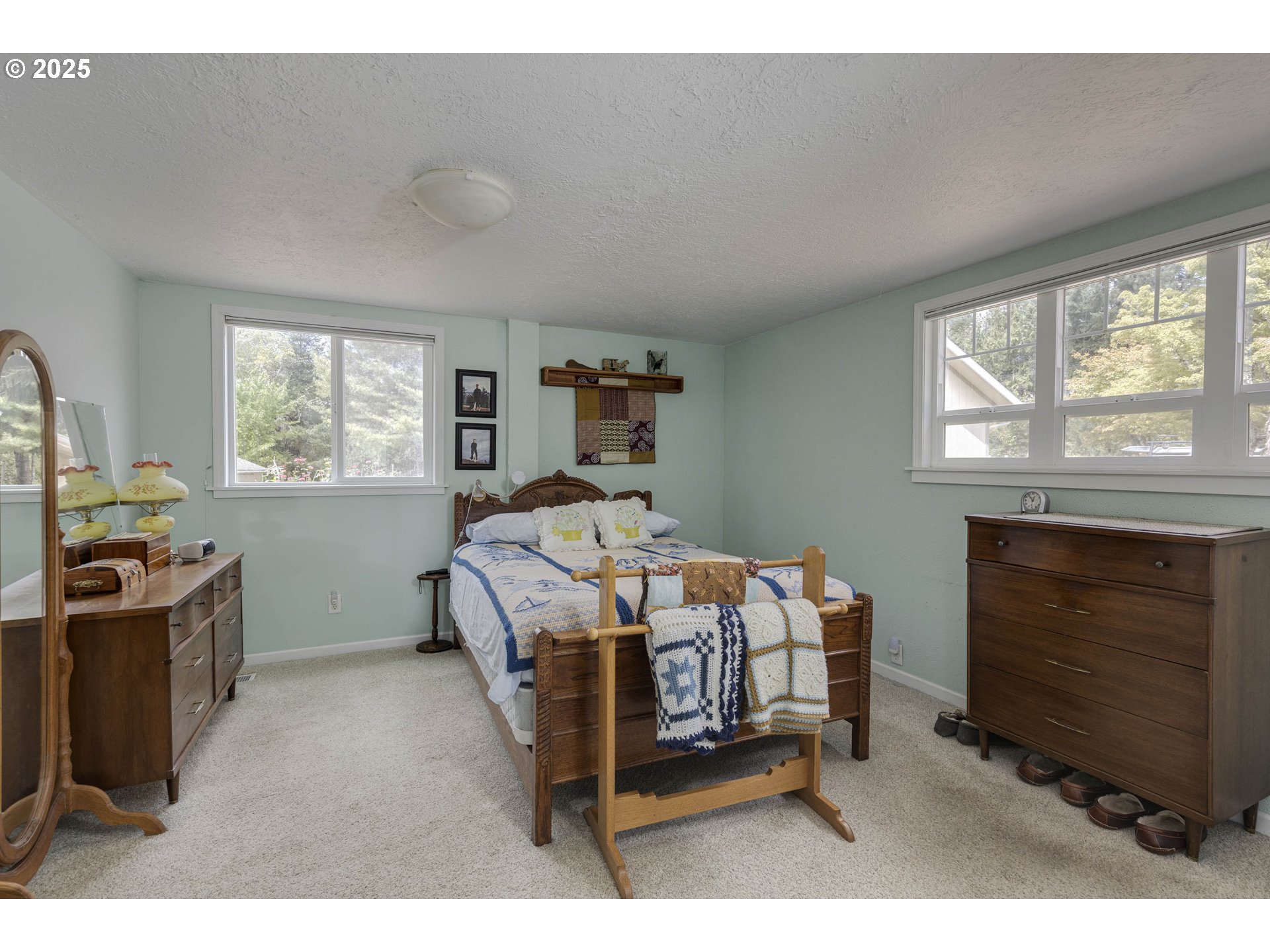 8205 Southwest Broadmead Road Amity, OR 97101 - Photo 8 of 30 a bedroom with furniture and a fireplace