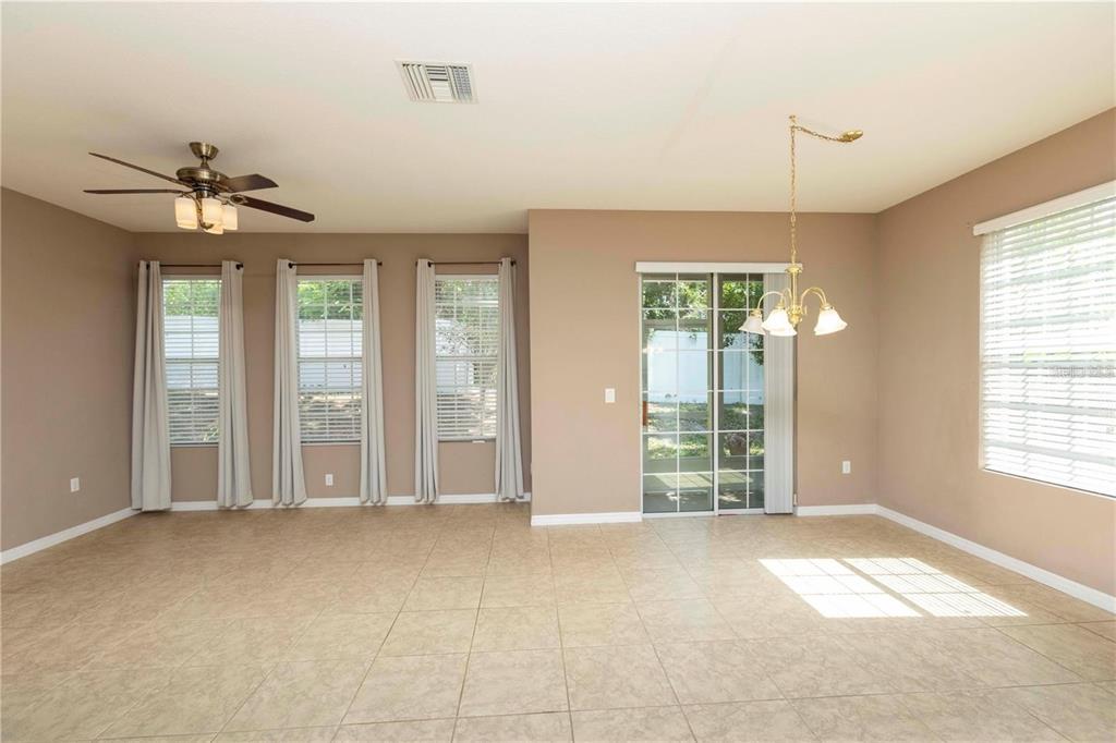 8409 Blue Rock Drive New Port Richey, FL 34653 - Photo 12 of 36 a view of livingroom with furniture window and hardwood floor