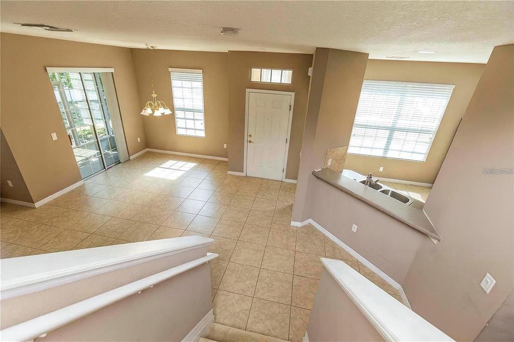 8409 Blue Rock Drive New Port Richey, FL 34653 - Photo 18 of 36 a view of a kitchen with an empty room and windows