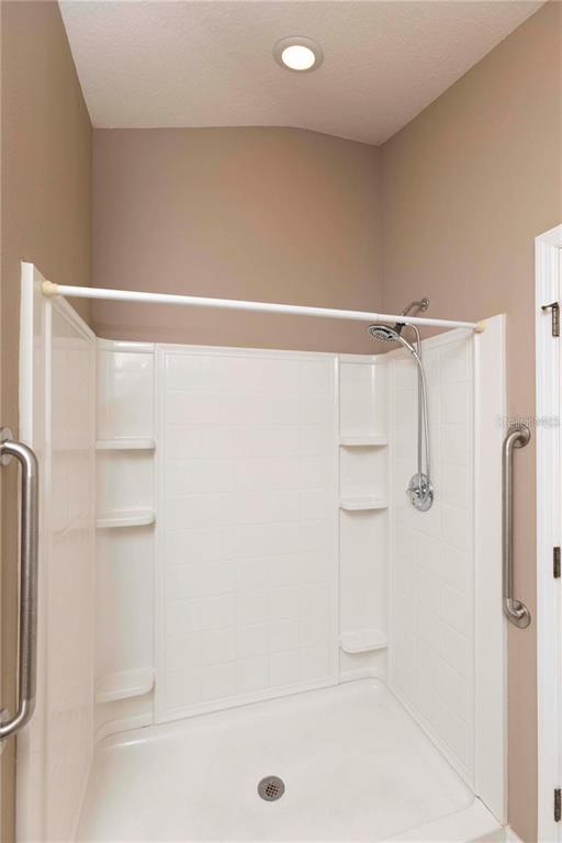 8409 Blue Rock Drive New Port Richey, FL 34653 - Photo 23 of 36 a bathroom with a shower