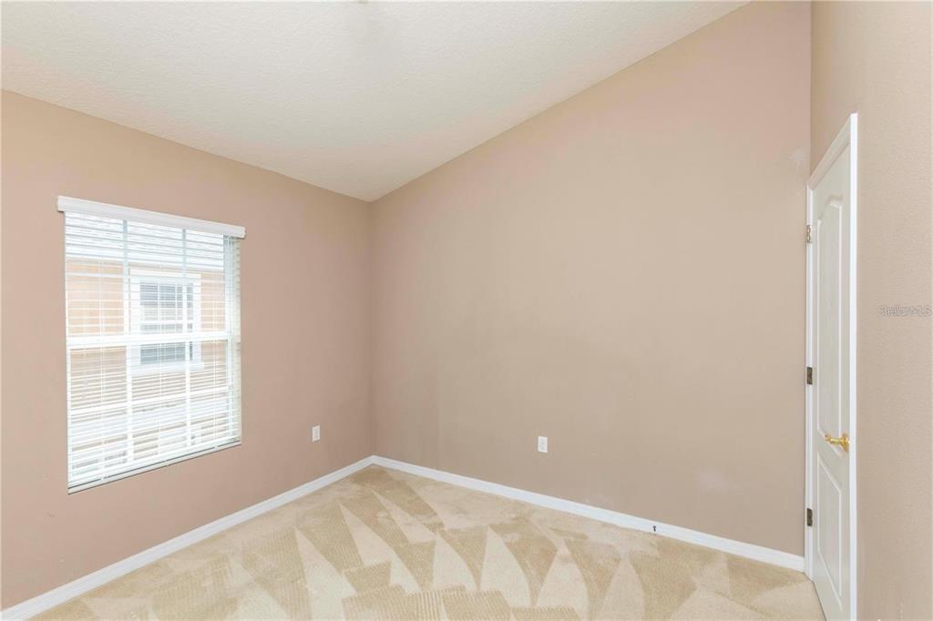 8409 Blue Rock Drive New Port Richey, FL 34653 - Photo 27 of 36 an empty room with windows