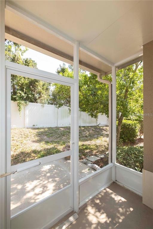 8409 Blue Rock Drive New Port Richey, FL 34653 - Photo 29 of 36 a view of a room with wooden floor and front door