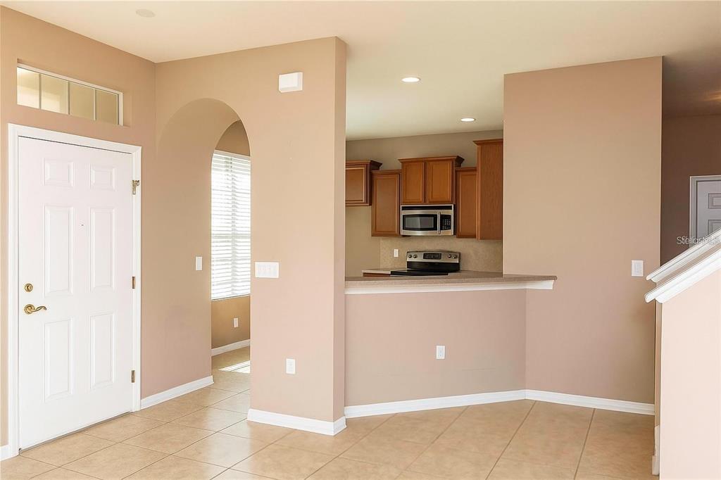 8409 Blue Rock Drive New Port Richey, FL 34653 - Photo 6 of 36 a view of kitchen with stainless steel appliances a refrigerator and a stove top oven