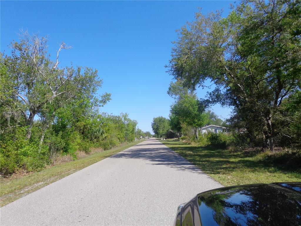 213 Evergreen Street Punta Gorda, FL 33982 - Photo 7 of 10 a view of a street with a yard