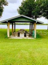 213 Evergreen Street Punta Gorda, FL 33982 - Photo 9 of 10 a front view of house with garden