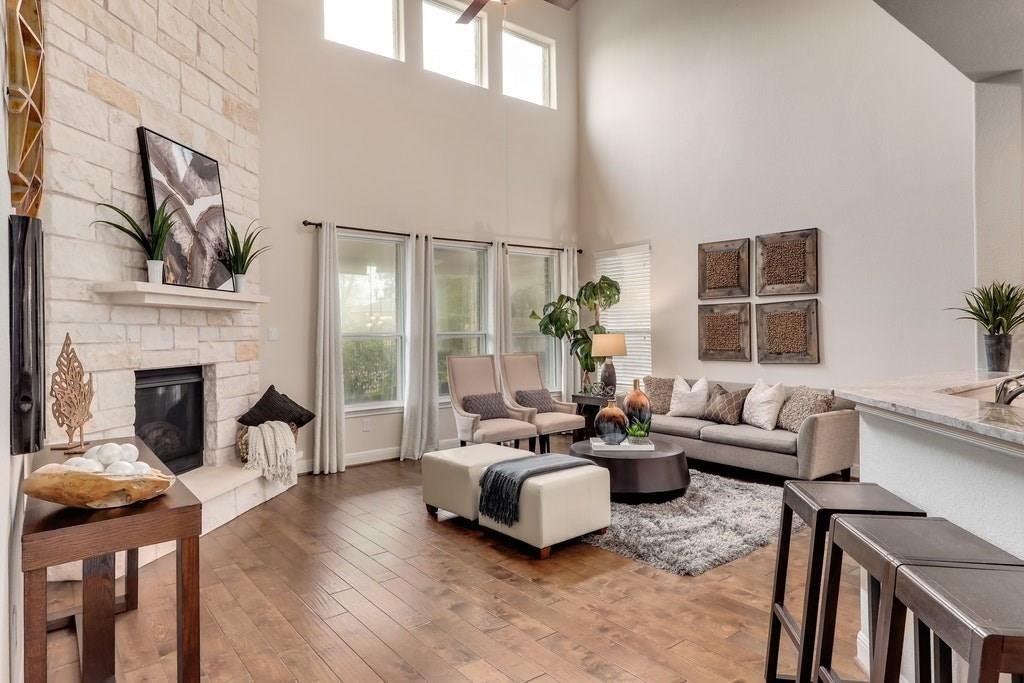 10825 Ballard Path Austin, TX 78717 - Photo 5 of 39 a living room with furniture and a fireplace
