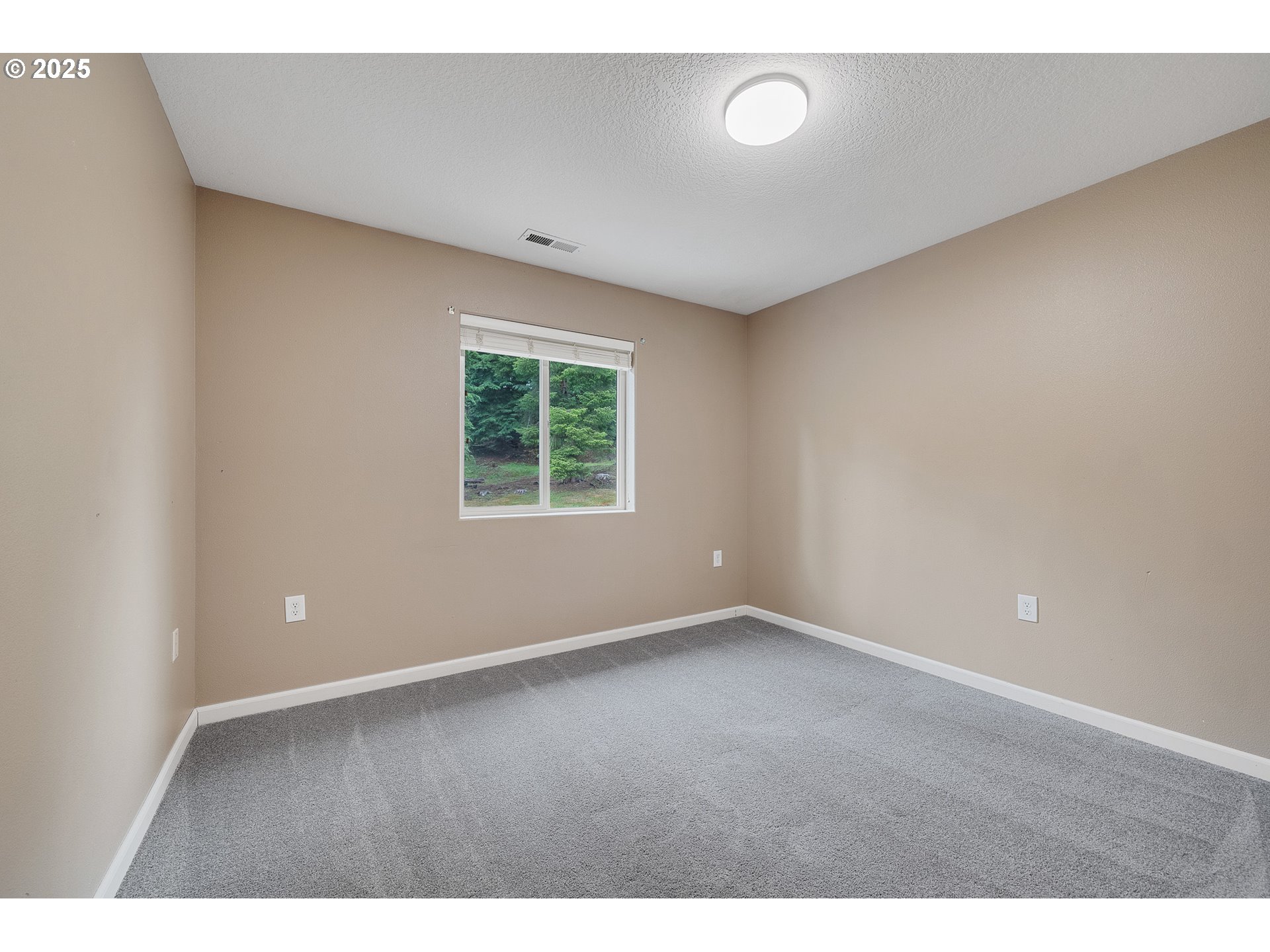 3355 Hubert Road Tillamook, OR 97141 - Photo 17 of 35 a view of an empty room with a window