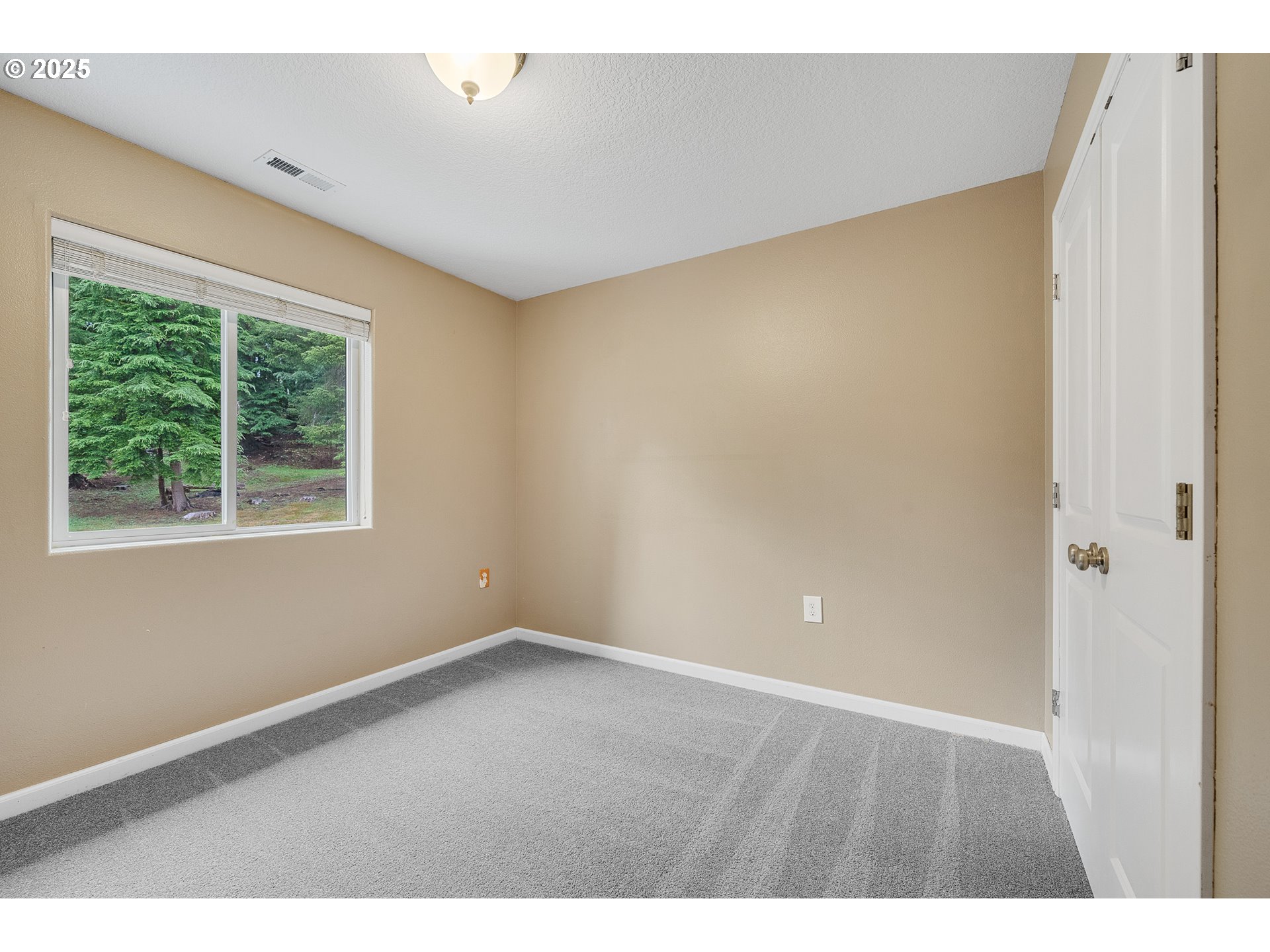 3355 Hubert Road Tillamook, OR 97141 - Photo 20 of 35 a view of an empty room with a window