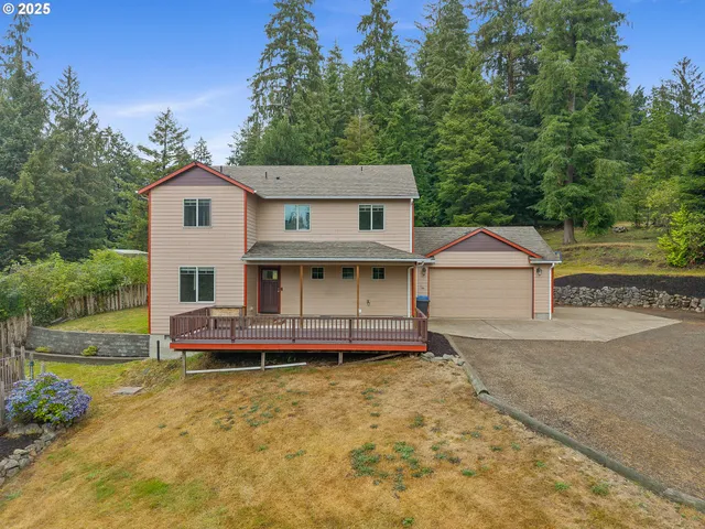 an aerial view of a house with swimming pool and garden