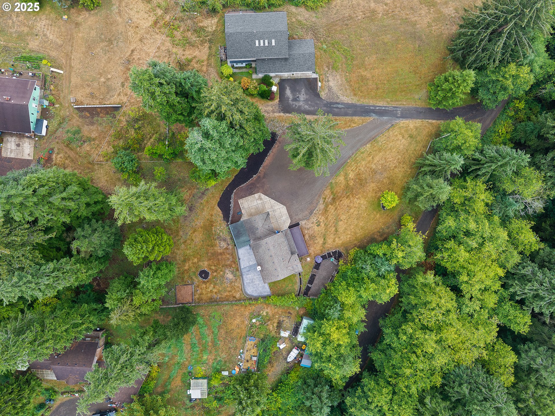 3355 Hubert Road Tillamook, OR 97141 - Photo 31 of 35 an aerial view of a house with a garden and swimming pool