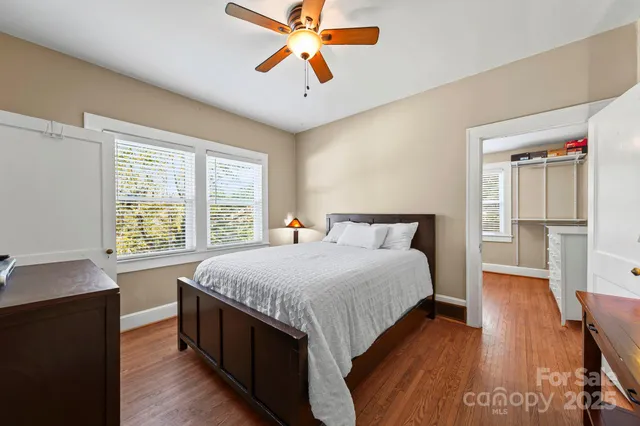 a bedroom with bed and window