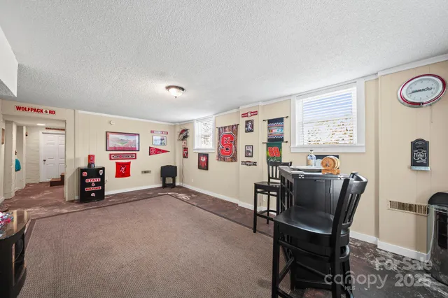 a view of a livingroom with furniture and a window