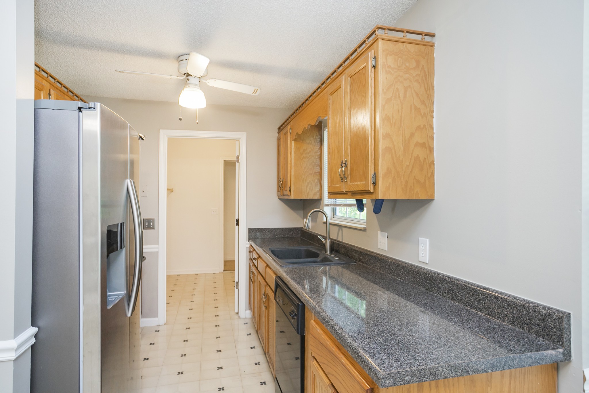 1609 Robards Way Hermitage, TN 37076 - Photo 12 of 43 a kitchen with stainless steel appliances granite countertop a sink a refrigerator and a stove
