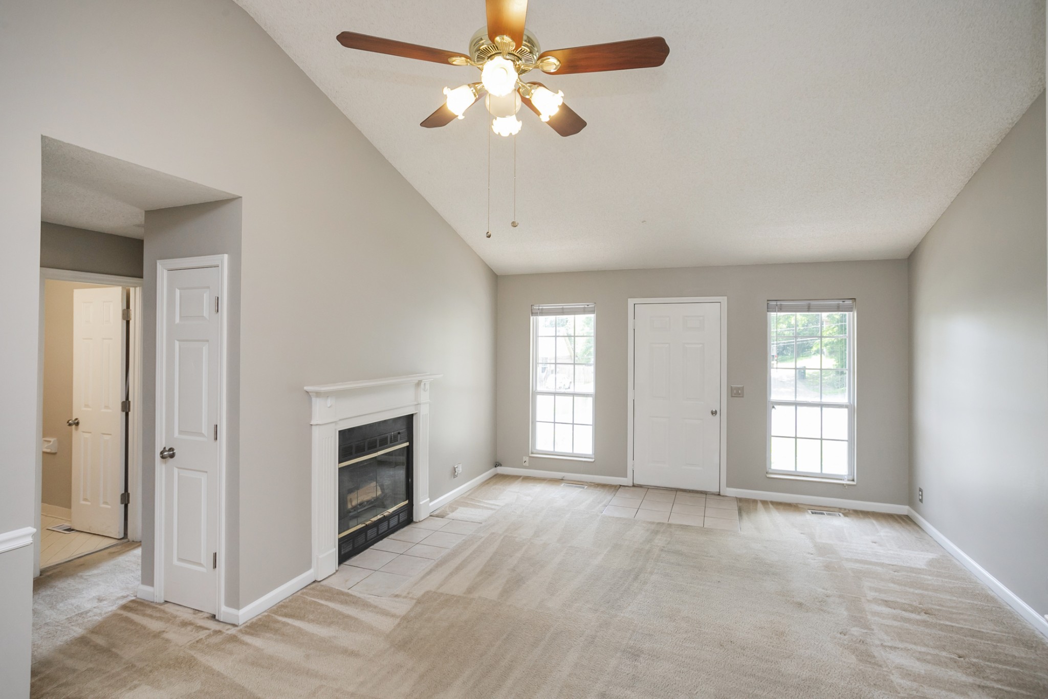 1609 Robards Way Hermitage, TN 37076 - Photo 2 of 43 a view of an empty room with a fireplace and a window