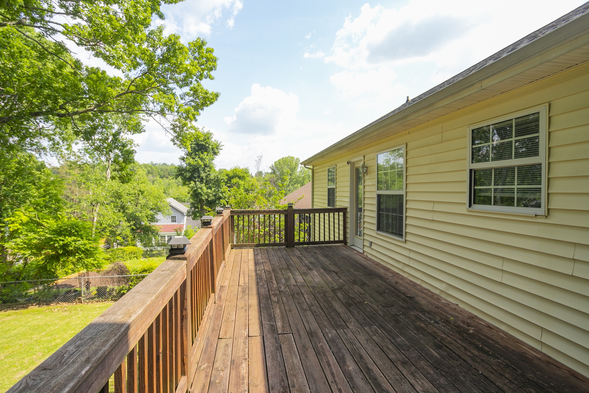 1609 Robards Way Hermitage, TN 37076 - Photo 38 of 43 a view of a balcony with wooden floor and fence