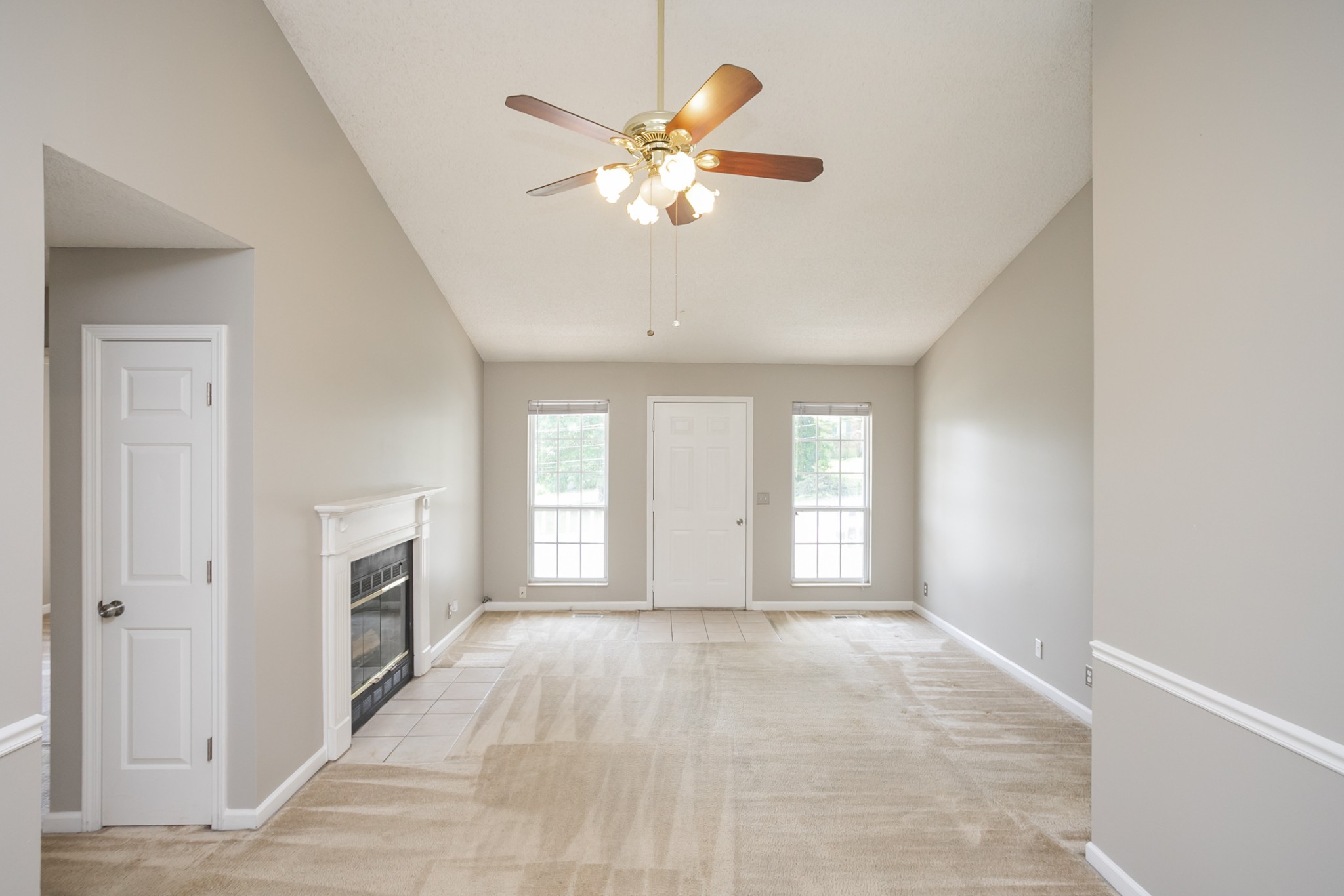 1609 Robards Way Hermitage, TN 37076 - Photo 9 of 43 a view of an empty room with chandelier fan and fire place