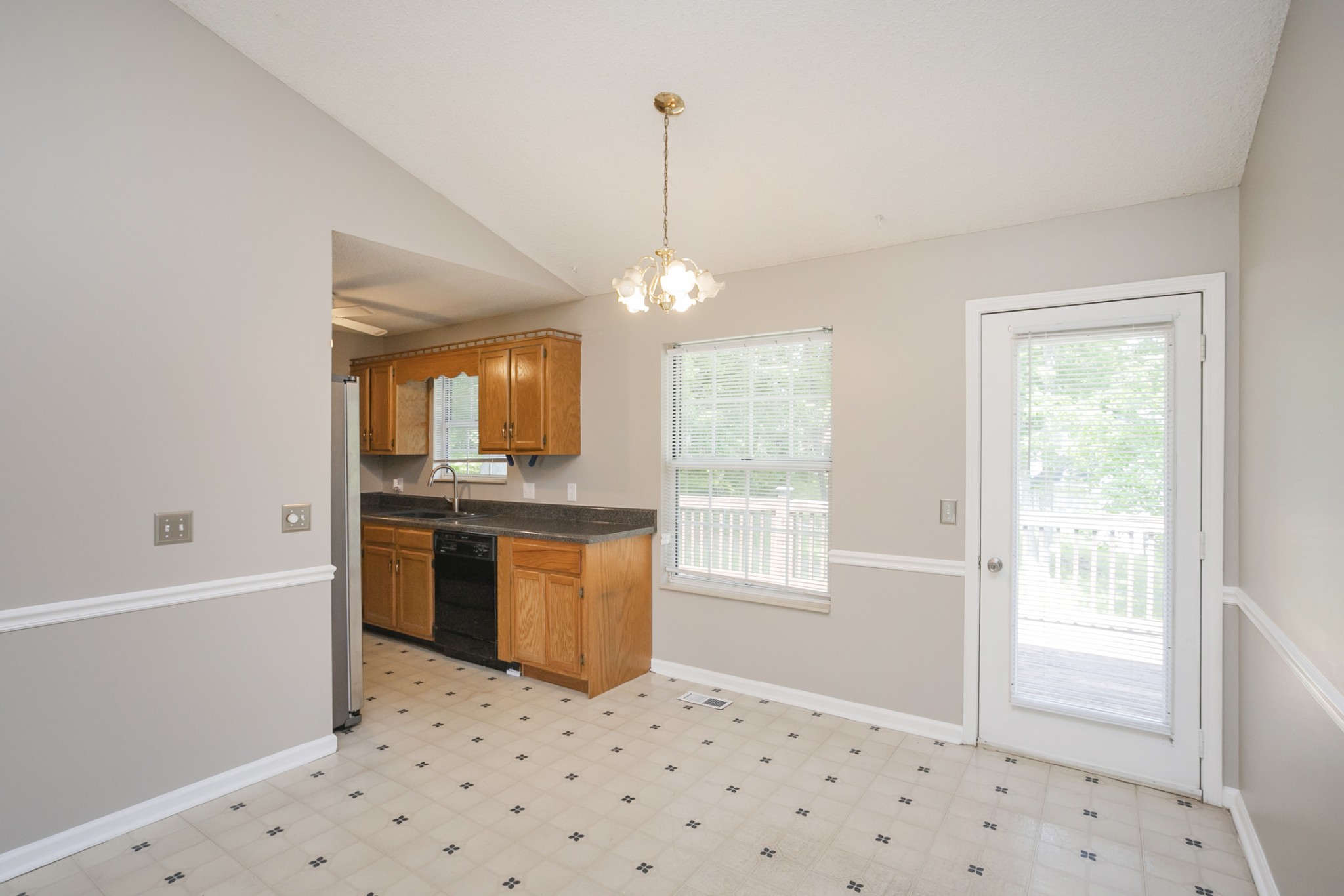 1609 Robards Way Hermitage, TN 37076 - Photo 10 of 43 a kitchen with granite countertop a sink and a refrigerator