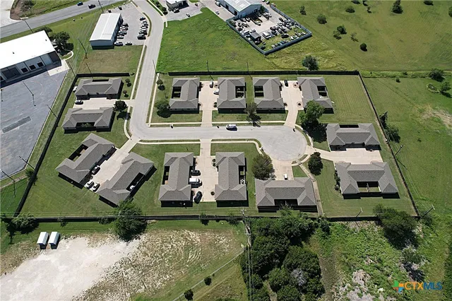 an aerial view of a house with a swimming pool