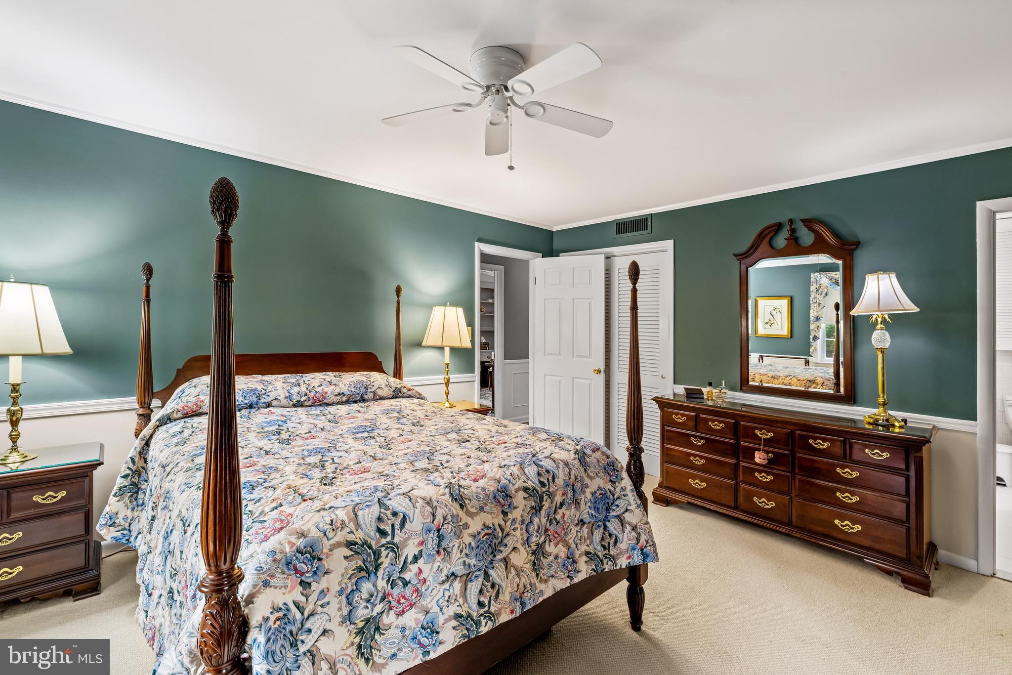 200 Purlington Road Lutherville-Timonium, MD 21093 - Photo 27 of 50 a bedroom with a bed a chandelier and a dresser