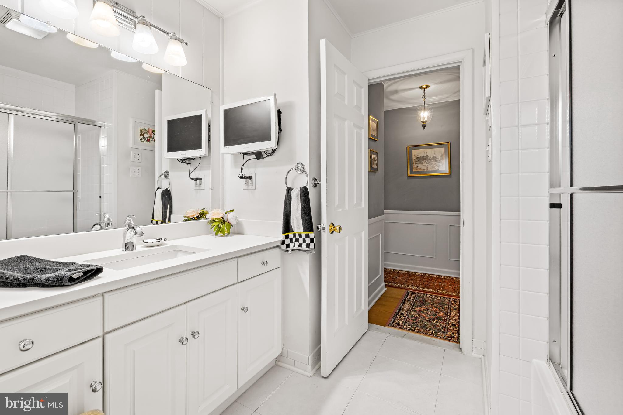 200 Purlington Road Lutherville-Timonium, MD 21093 - Photo 28 of 50 a spacious bathroom with a granite countertop sink and a mirror
