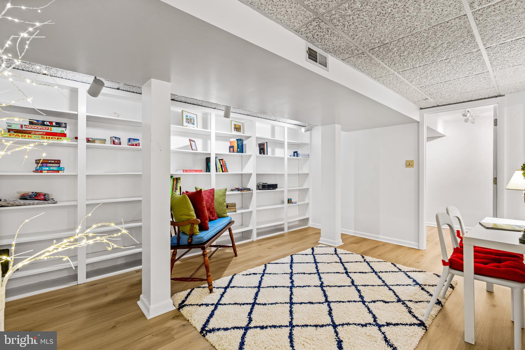200 Purlington Road Lutherville-Timonium, MD 21093 - Photo 36 of 50 a bedroom with furniture and a book shelf