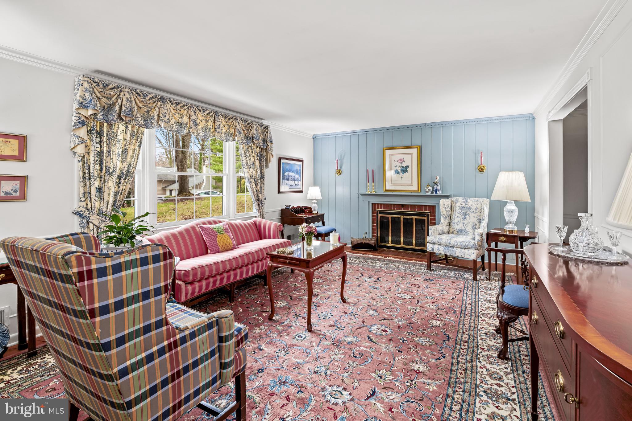 200 Purlington Road Lutherville-Timonium, MD 21093 - Photo 8 of 50 a living room with furniture a large window and a fireplace
